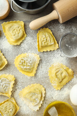 Concept of cooking ravioli on wooden background