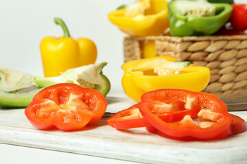 Concept of tasty food with bell pepper on white background