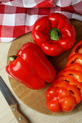 Concept of tasty food with bell pepper on wooden background