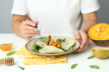 Concept of tasty eating with pumpkin salad on white table