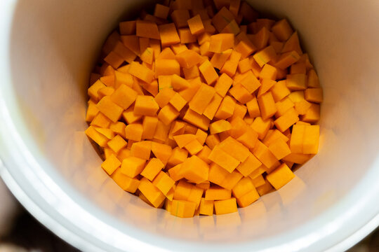 Pumpkin cut into cubes in a pan, cooking gar