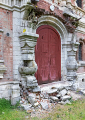 Fototapeta na wymiar Ruined ancient portal door entrance to the building