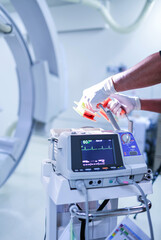 Heart rate monitor in hospital theater. Electrocardiogram in hospital surgery operating emergency room showing patient heart rate . heart rate monitor in Emergency Room.