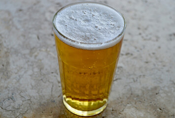 A Canadian lager in a glass on the table