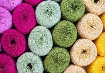 Close Up of yarn balls. Rainbow colors. Yarn for knitting. Skeins of yarn. Knitting needles,...