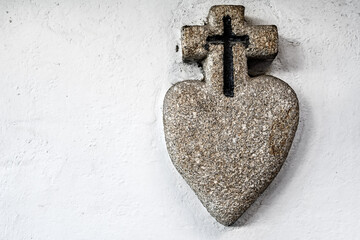 sacred heath of Jesus made of stone on white wall