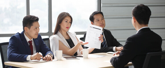 group of business people in suits and Human resources manager female interviewing new worker or employee . serious interviewer woman in job interview