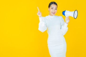 Portrait beautiful young asian woman smile with megaphone