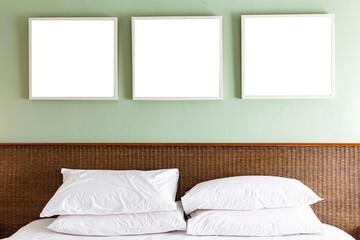Empty picture frame above the bed in a modern bedroom