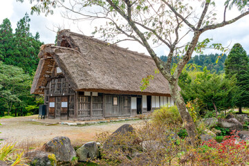 Fototapeta na wymiar Old traditional Japanese house with thatched roof