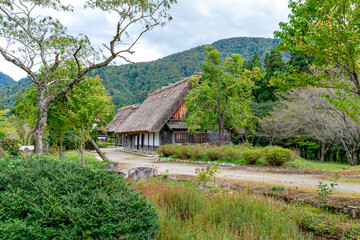 Obraz premium Old traditional Japanese house with thatched roof