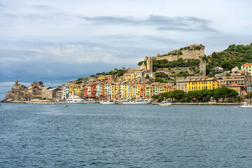 Fototapeta premium Cityscape of Porto Venere or Portovenere seen from the Mediterranean sea (Ligurian sea), Gulf of La Spezia, UNESCO world heritage site, La Spezia, Liguria, Italy, southern Europe.