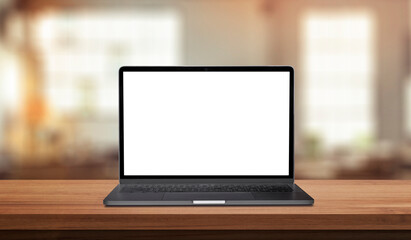Laptop space gray with blank screen on wood table in blurry background with house or office modern ,nature orange bokeh and sunlight in morning.
