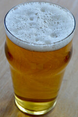 A Japanese golden lager in a glass on the table