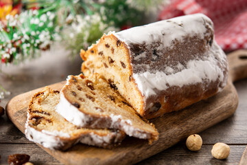 Traditional German Christmas stollen on wooden table