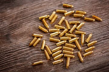 Bullets on wooden desk