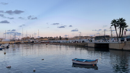 Fototapeta na wymiar A boat moored near the bridge to Manoel Island in Gzira Malta.