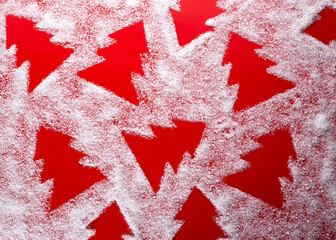 Red Christmas background with spruce snow pattern