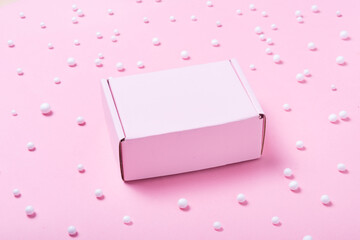 pink cardboard box decorated with white balls