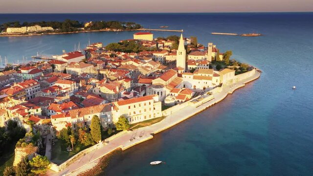Drone video of flight over Croatian coastal town Porec during sunrise