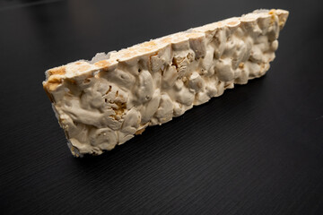 Perspective view of Christmas Turron over black background.