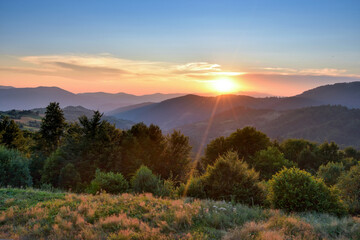 Obraz na płótnie Canvas Fantastic sunset and bright grass in sunlight. Carpathian, Ukraine, Europe.