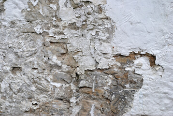 Close Up of Rough Textured Plaster Wall  with Flaking Paint