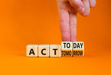 Act today not tomorrow symbol. Businessman turns wooden cubes, changes words act tomorrow to act...