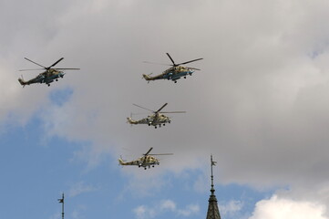 A group of Mi-35M and Mi-24 attack combat helicopters in the sky over Moscow's Red Square during...