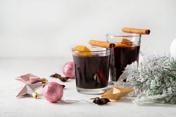 Two glasses of hot wine with spice and fruits winter beverages close up
