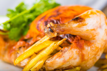 Fried chicken with potatoes on a plate