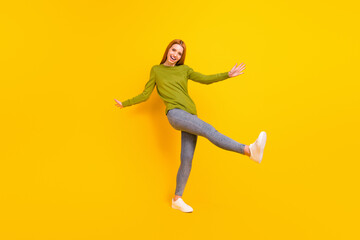 Fototapeta na wymiar Full length body size photo dancing in casual clothes girl at party isolated vibrant yellow color background