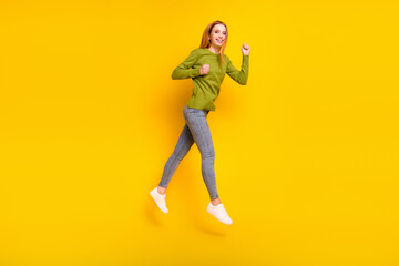 Full length body size photo jumping up gesturing like winner isolated vibrant yellow color background