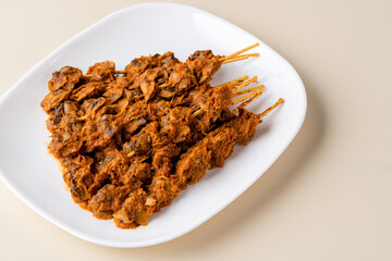 Sate Kerang Or Satay Kerang is a Traditional Indonesian Food made from Shell and covered with sauce. Sate Kerang Angkringan.  Selective focus. macro food.