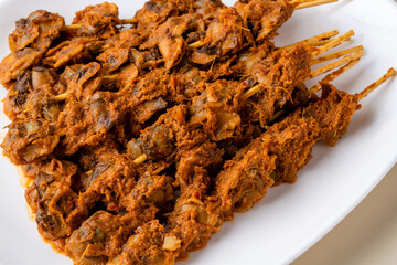 Sate Kerang Or Satay Kerang is a Traditional Indonesian Food made from Shell and covered with sauce. Sate Kerang Angkringan.  Selective focus. macro food.