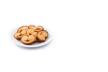 Palmier puff pastry in plate isolated on white background