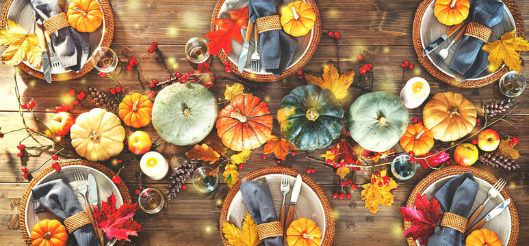 Autumnal decorated table for celebrating Thanksgiving or other family celebration