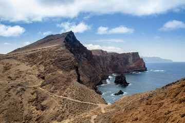 Ilhéu da Cevada, Madeira, view over rocks and sea with cloudy sky