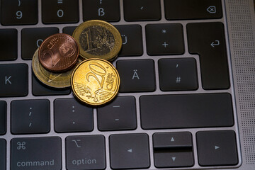 laptaop keyboard with copyspace on which money lies