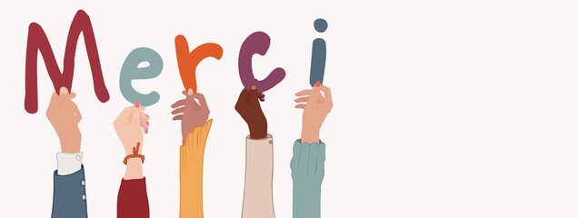 Fototapeta premium Up arms of a group people holding the letters forming the word thank you in French -Merci- in their hands.Teamwork.Gratitude and agreement between colleagues or friends. Appreciation