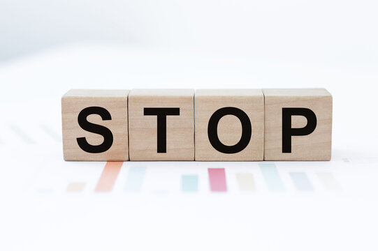 Four Wooden Cubes With Letters Stop. Business Marketing Concept.