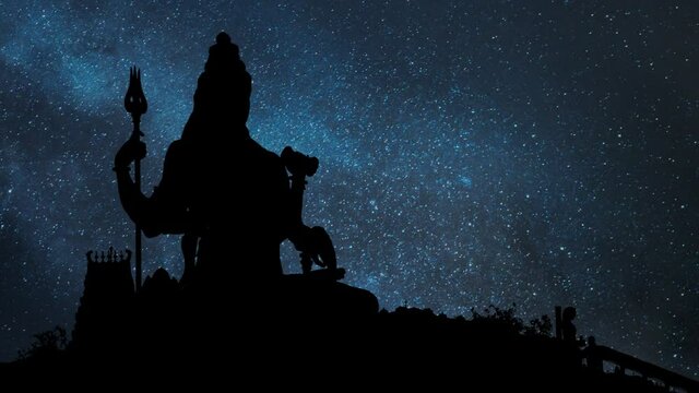 Shiva Statue by Night: Time Lapse with Stars and Milky Way in Background