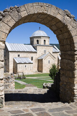 The church of the Gradac monastery is visible through the arch
