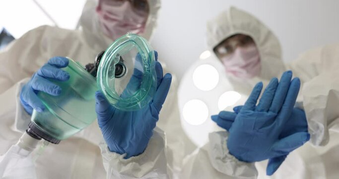Doctors in protective suits providing resuscitation assistance to patient 4k movie