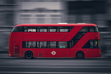 Obraz na płótnie Canvas New Routemaster red doubledecker bus in Motion in London from the side