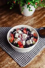 Salad in a disposable glass close-up. Healthy and fast food. Takeaway cafe. Disposable tableware for food safety. Healthy fast food
