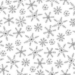 Snowflakes seamless pattern. Black doodle snowflakes on white background. Line art. Background for winter design. 