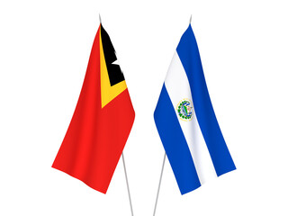 National fabric flags of East Timor and Republic of El Salvador isolated on white background. 3d rendering illustration.