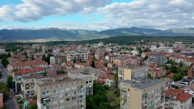Aerial drone video of Kazanlak town in Stara Zagora Province at the foot of the Balkan mountain range of Bulgaria