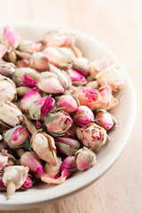 Dried rose buds in a bowl